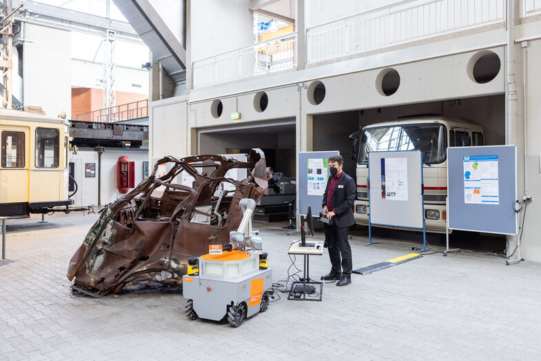 Doctoral student operates OmniMan an Omnidirectional mobile manipulator (robot).