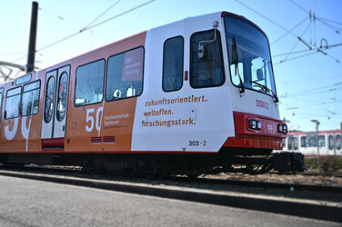 Photo of a subway with FH stickers for the 50th anniversary.