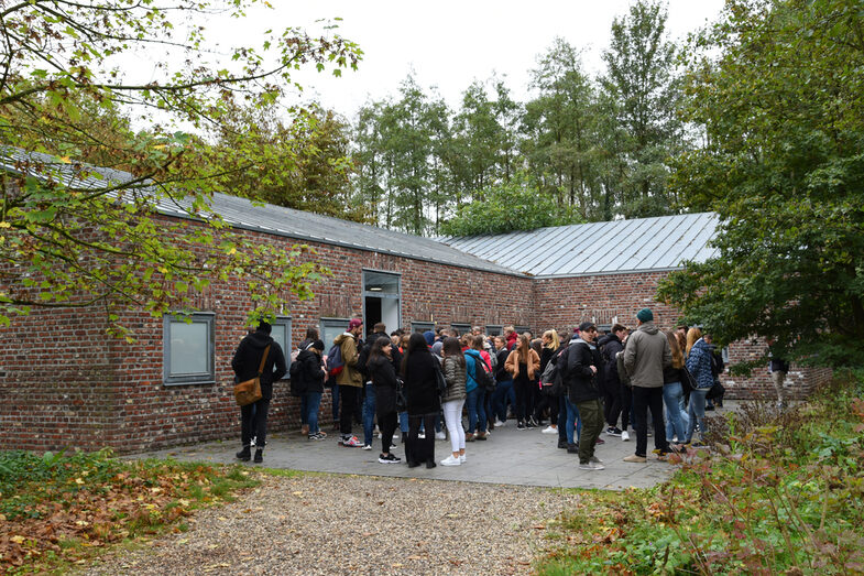 People standing in front of a building.