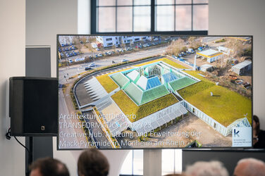 Close-up of a presentation screen with an image of the Franz Mack pyramid for the TRANSFORMATION Competition 2023