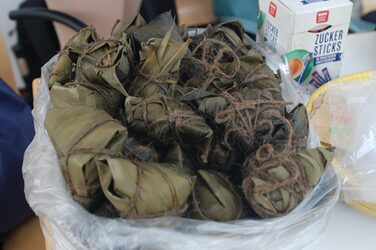 Small banana leaf packets filled with a traditional meal at the China culture stall.