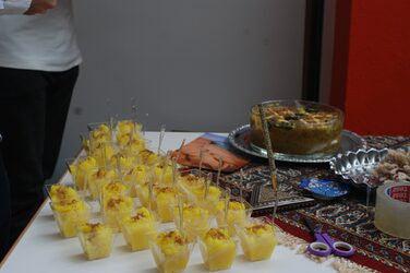 Cultural stand Iran: table with many traditional delicacies.