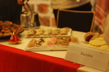 Eating on a decorated table at the Morocco cultural stand