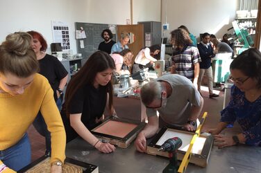 Students and lecturer shuttering the slabs in the concrete laboratory