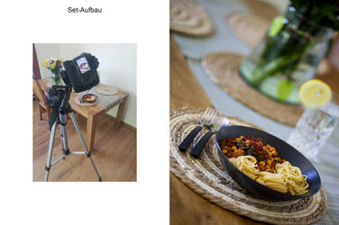 From a tripod, a camera looks down vertically onto an arrangement on the floor below: brown cake, a bowl of cherries and other objects, as well as light and dark cardboard to control the light.