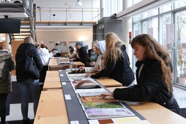 On display are students touching and touching the individual material samples during the exhibition opening