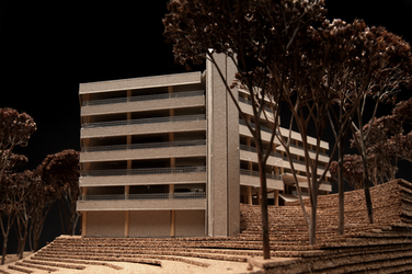 A detailed close-up shows the façade of the model building with terraces and columns. In the foreground are modeled trees on stepped layers of terrain.