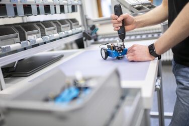 Photo of a detailed view of the screwdriving process for assembling a demonstration product in the Lean Lab.