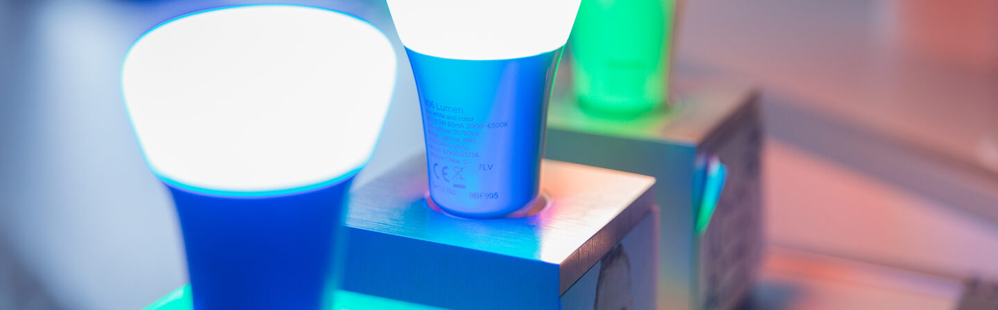 Photo of activated lamps from the Smart Living section, in blue, green and red.