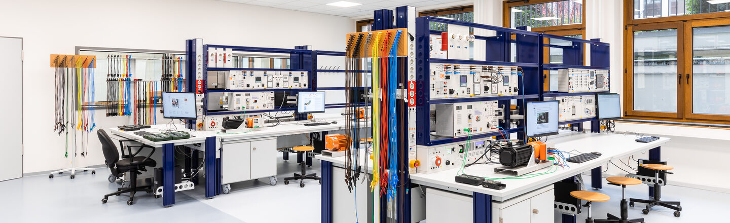 Photograph of the laboratory for electrical machines with a wide range of equipment.