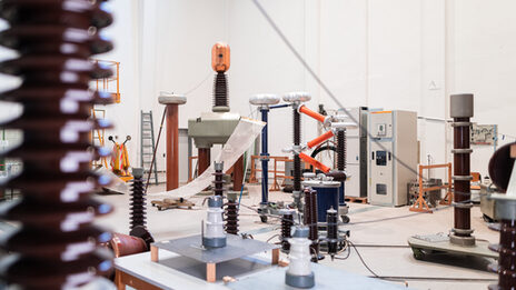 Photograph of the high-voltage laboratory with a wide range of laboratory equipment. __