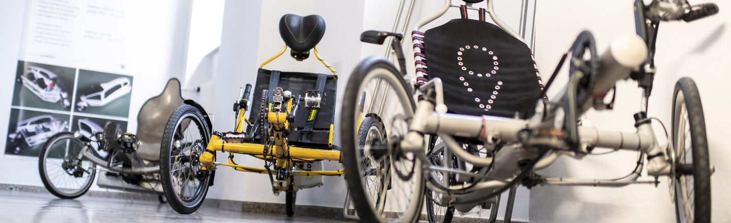 Three lightweight vehicles in white, yellow and silver.