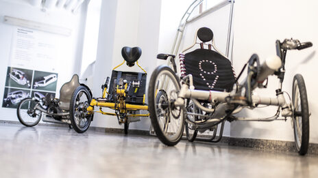 Three lightweight vehicles in white, yellow and silver.