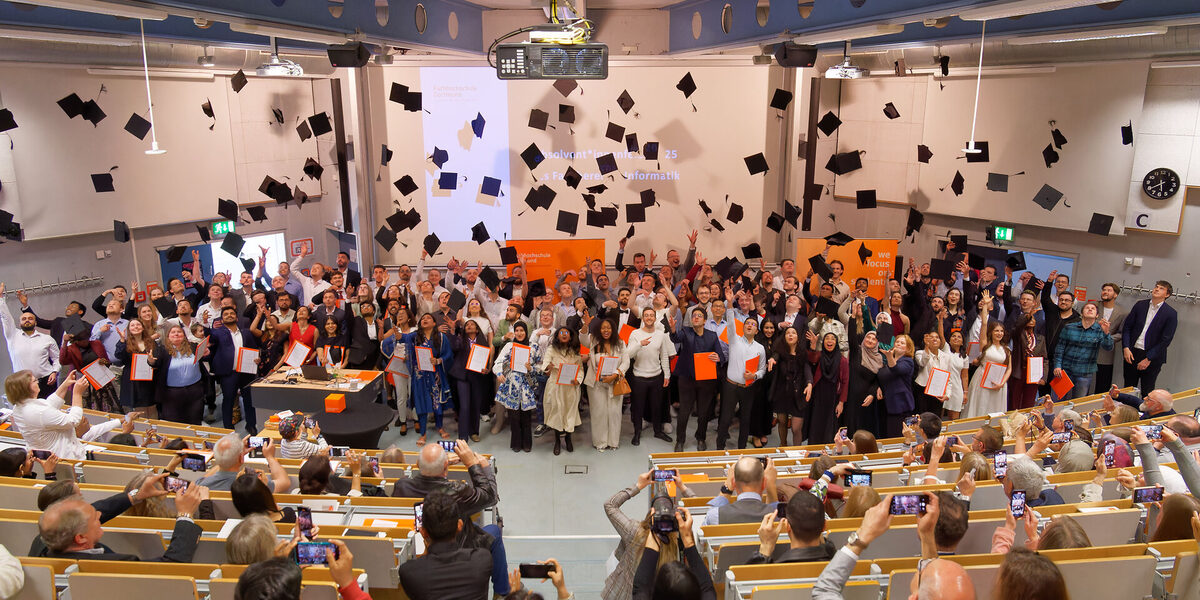 Traditional hat toss of the graduates at the graduation ceremony 2025 of the Department of Computer Science