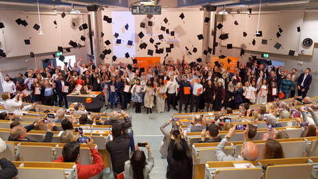 Traditional hat toss of the graduates at the graduation ceremony 2025 of the Department of Computer Science