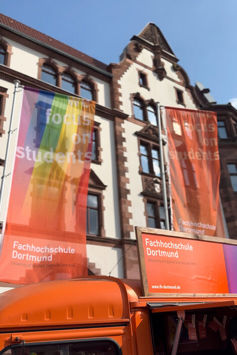 The Fachhochschule Dortmund rainbow flag flies in front of the old town hall of the city of Dortmund.