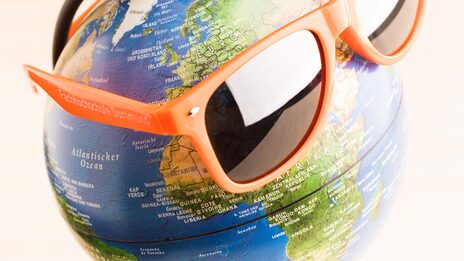 Photo of a globe wearing FH sunglasses.