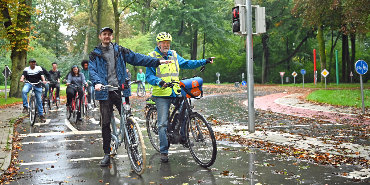 People ride bicycles