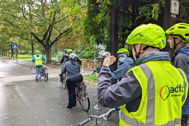 People ride bicycles