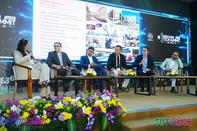 Several people sit on a podium
