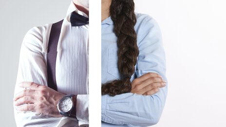 The symbolic image shows the upper body of a person in a shirt that is divided in the middle and read half female and half male.