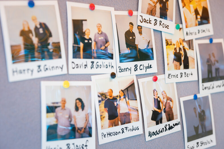 Polaroids on a pinboard show photographed pairs of a network game