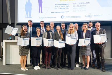 Group picture with several people, each holding a certificate in front of them.
