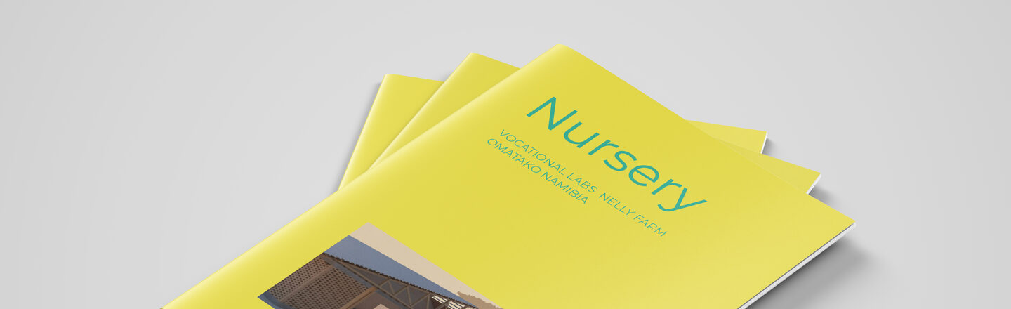 Close-up of the three brochures with yellow cover on gray background