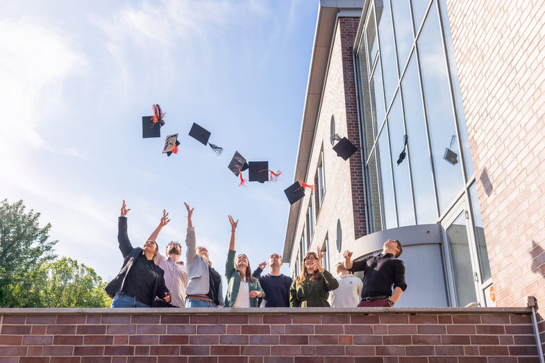 Graduate Center alumni throw their hats in the air
