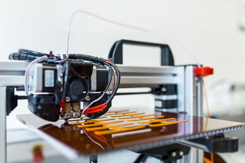 Photo or close-up of a 3D printer in action.